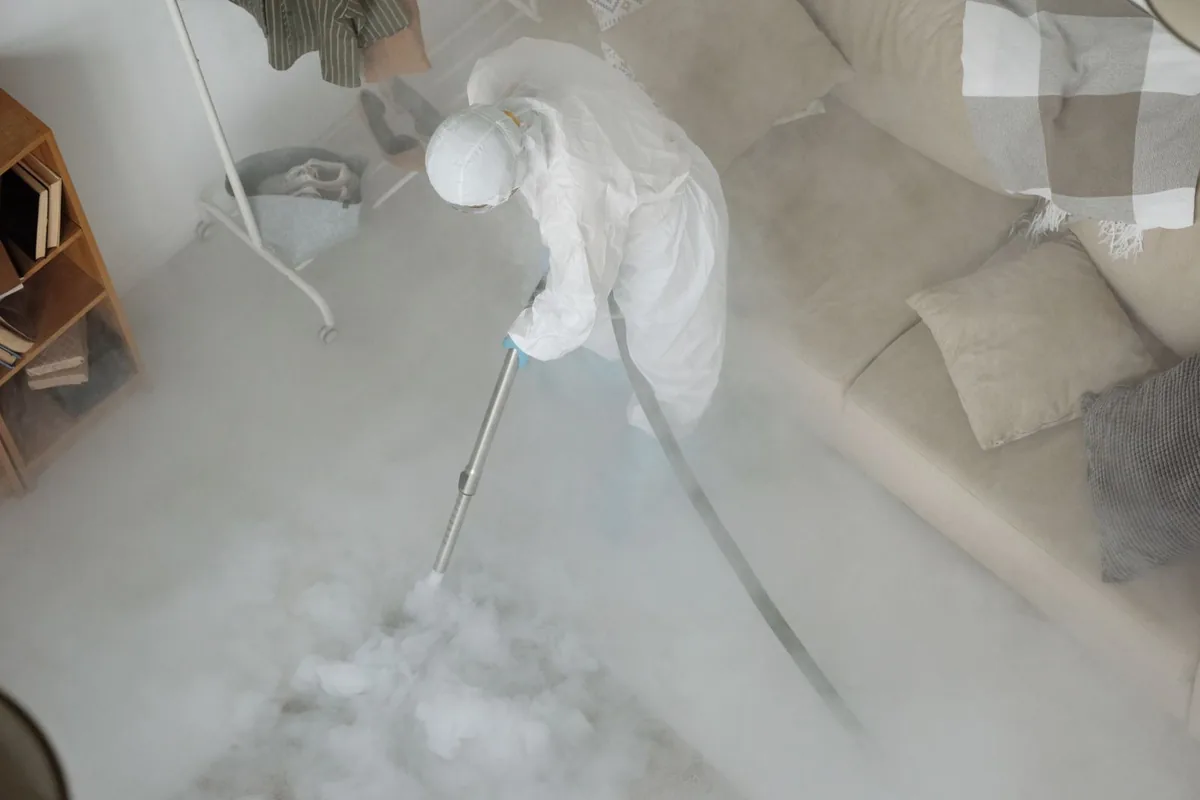 Biohazard cleanup technician in protective equipment, Washington, PA